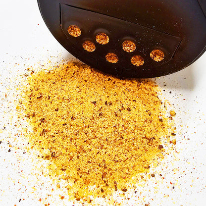 Close-up of spilled Phoenix Competition Chicken Rub - Bold and flavorful, macro view